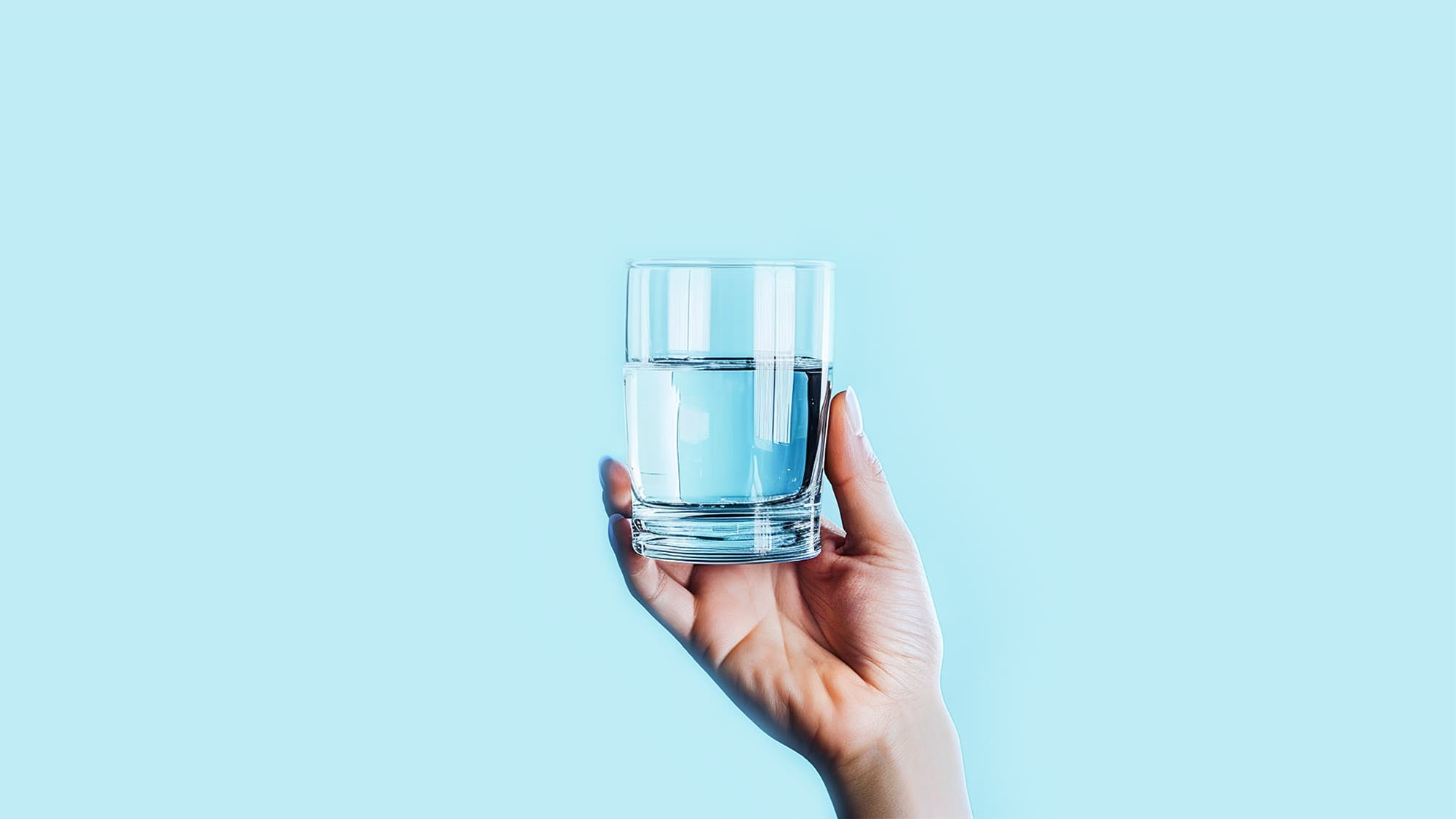 Someone holding a glass of water - Primo Water Education - Health