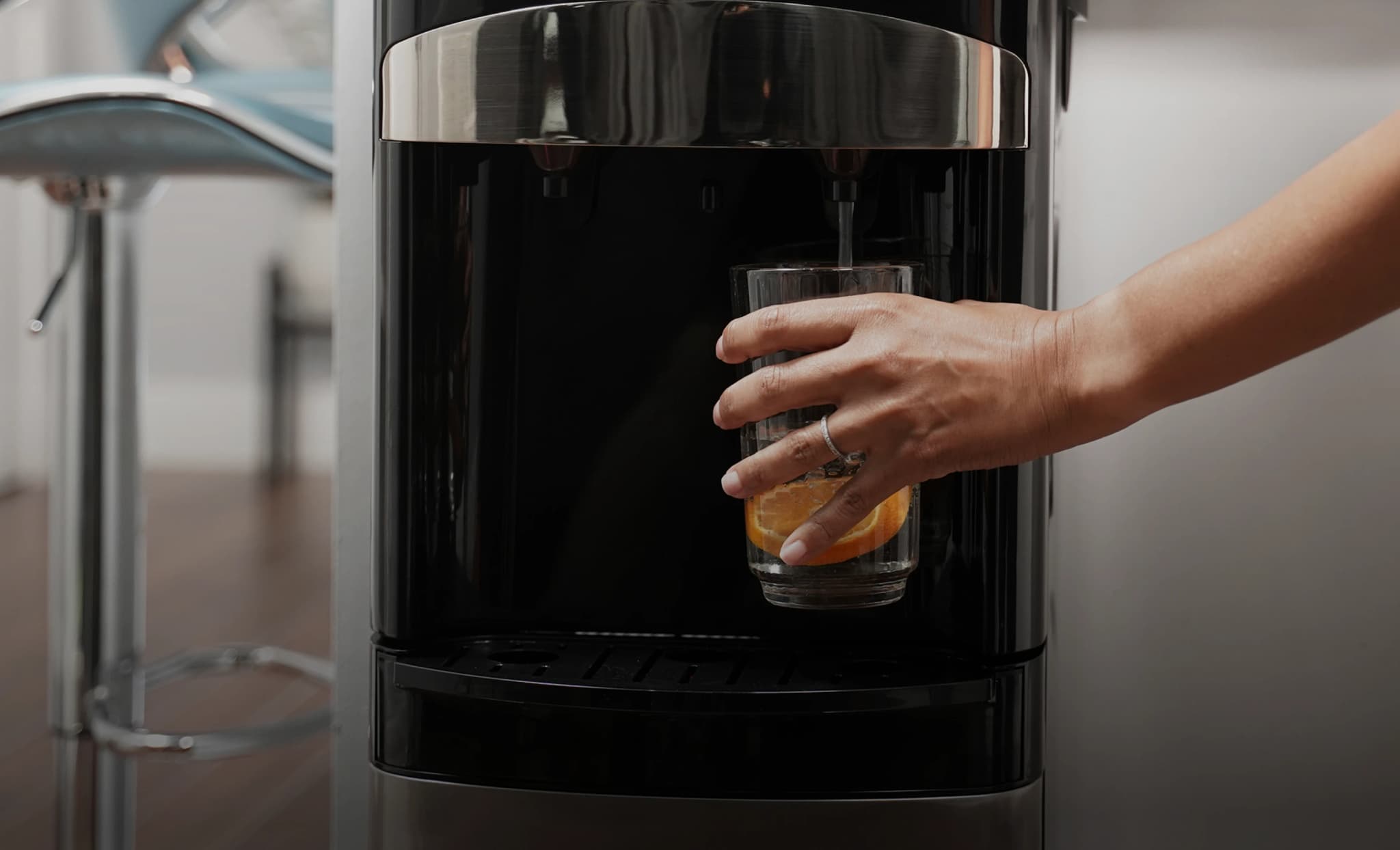 A customer using a Primo Water Dispenser