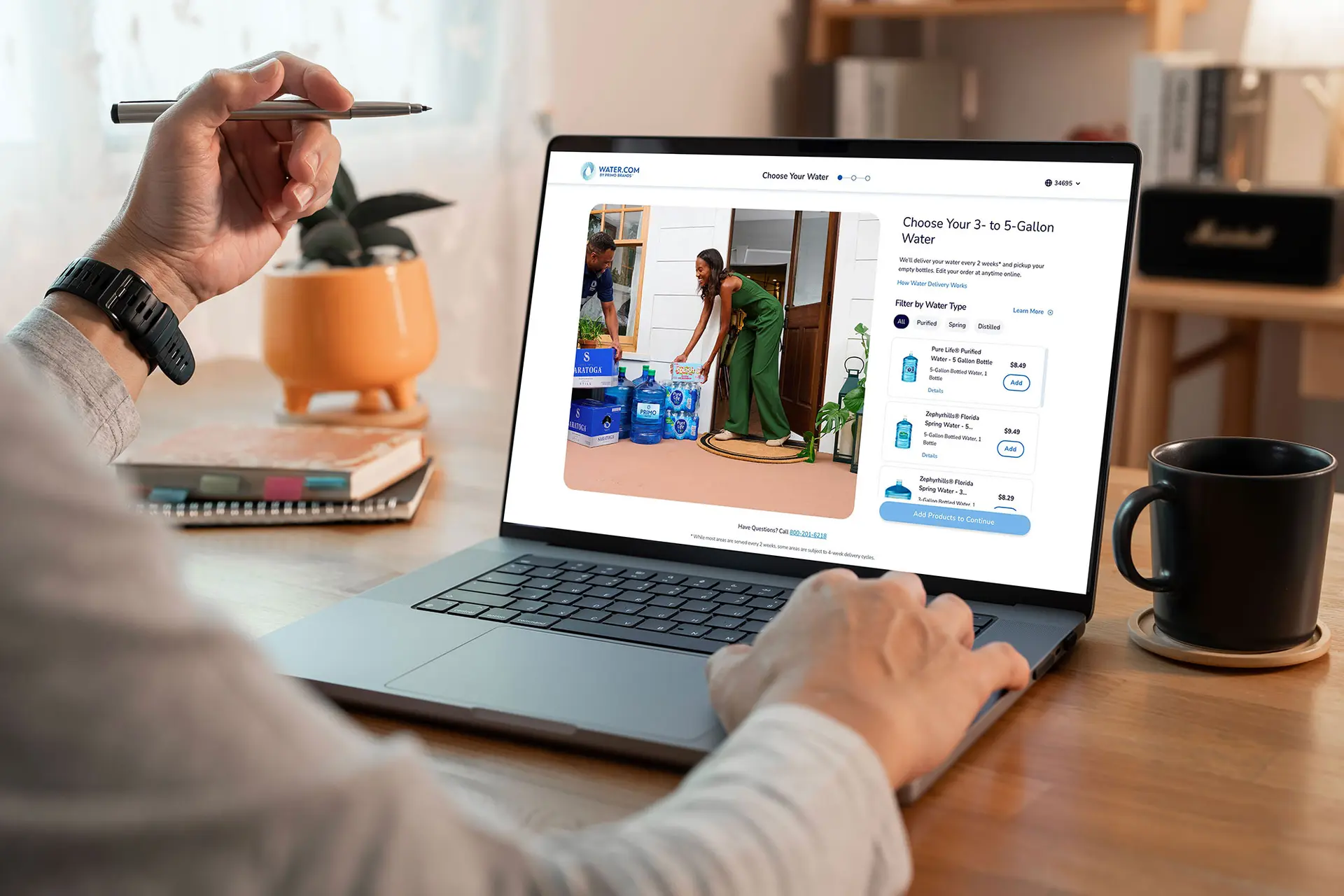 Person using a laptop to browse and select water delivery options, showing an image of a woman receiving bottled water at her doorstep.
