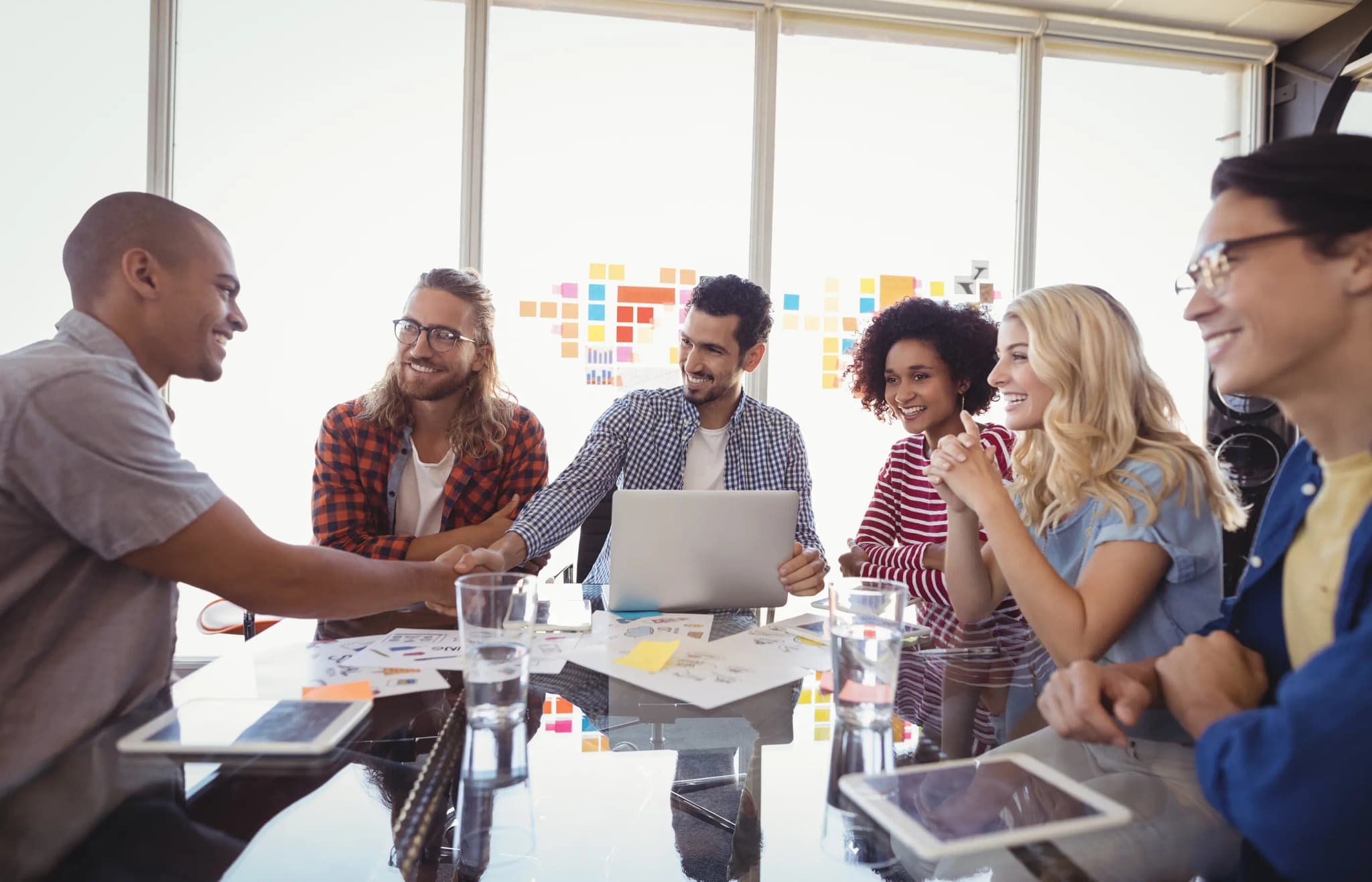 A group enjoying bottled water delivery at work