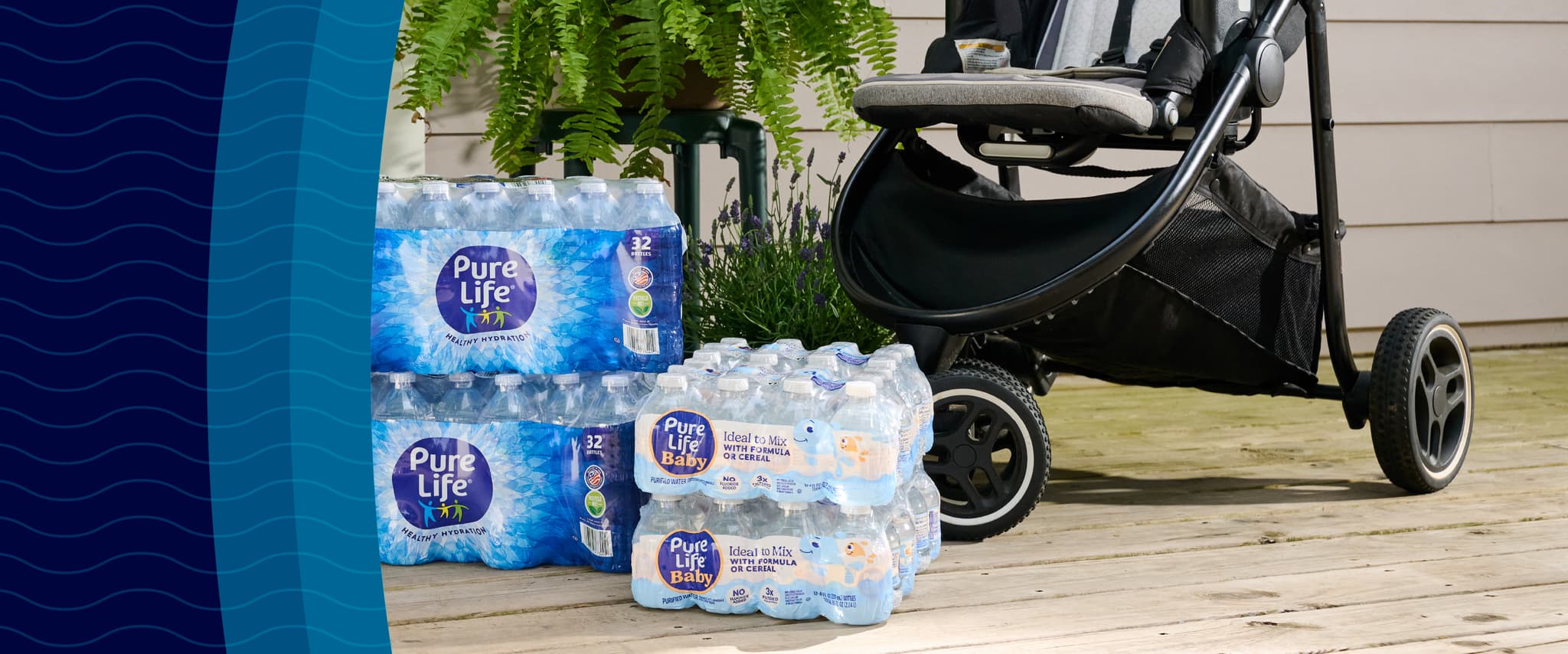 Stacks of Pure Life bottled nursery water beside a black stroller on a wooden deck, with a green fern in the background.