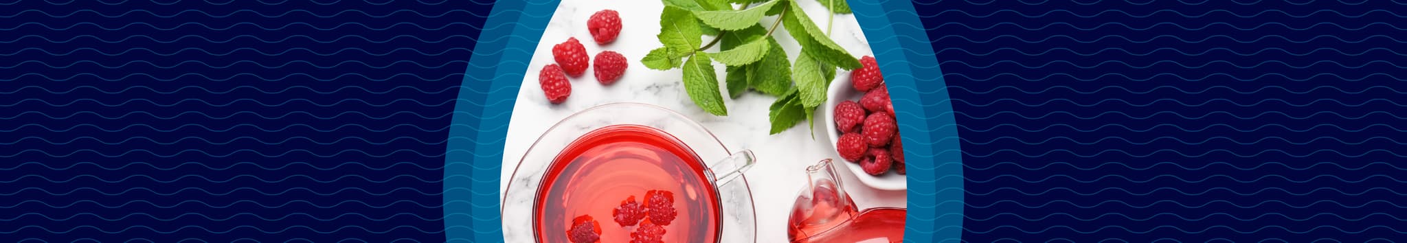 Raspberry tea with fresh raspberries and mint leaves on a white surface, framed by a blue, wave-patterned border.