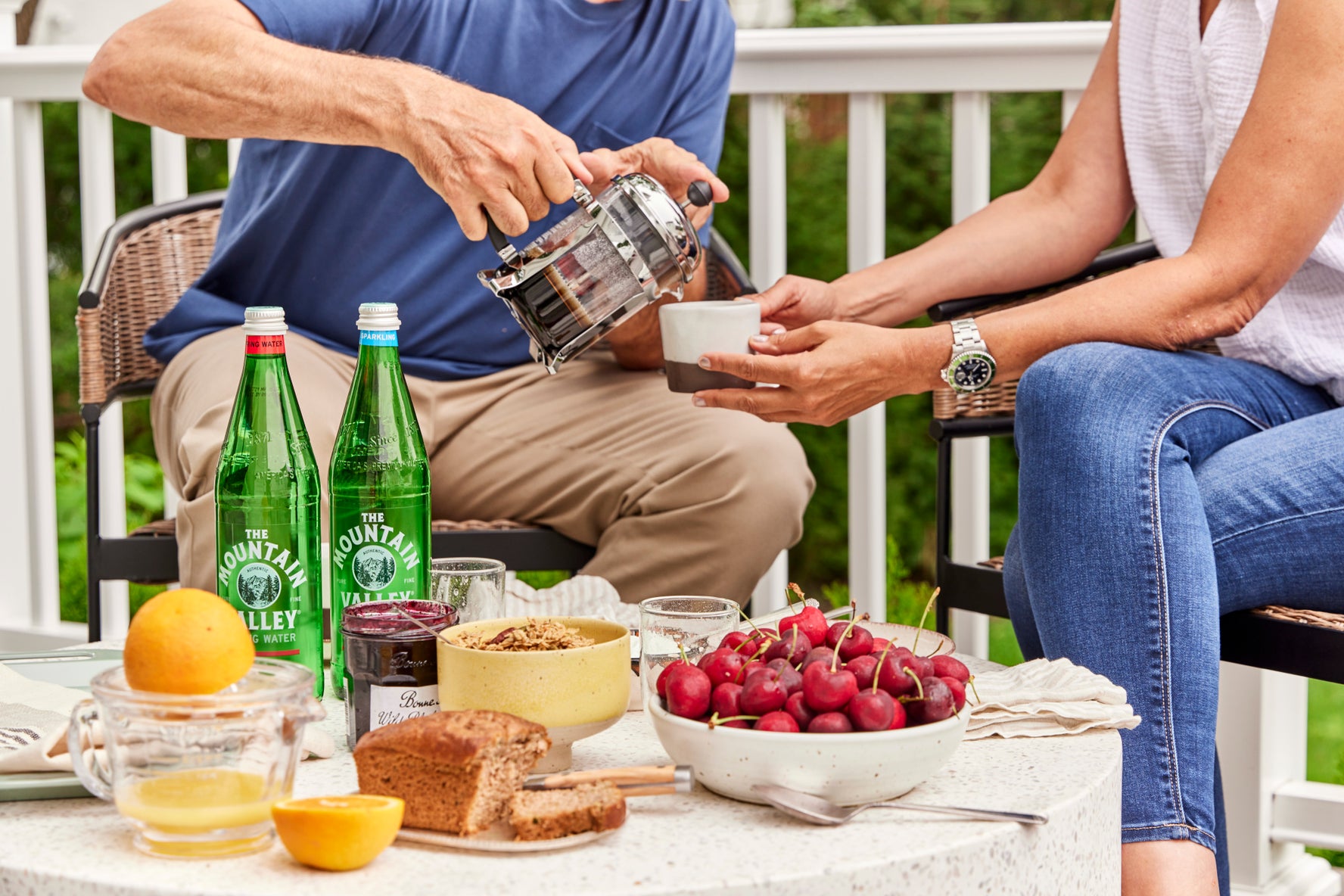 man and woman enjoying Mountain Valley on patio